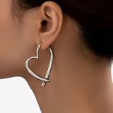 Jewelry : Boucles d'oreilles cœur personnalisées pour femme, polyvalentes et tendance pour toutes les occasions in couleur argent van Seroa
